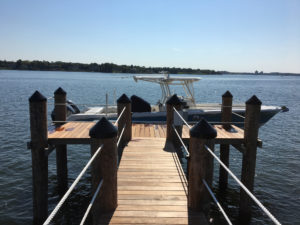 Marine construction wooden dock with boat lift